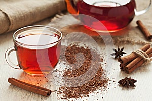 Healthy african rooibos tea in glass cup with photo
