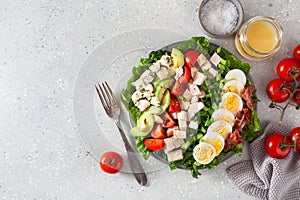 healthy American Cobb salad with egg bacon avocado chicken tomato. hearty keto low carb diet photo