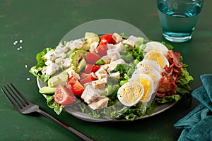 healthy American Cobb salad with egg bacon avocado chicken tomato. hearty keto low carb diet photo