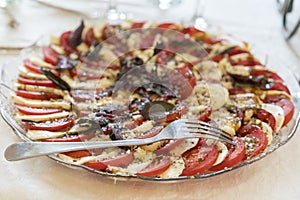 Healthy appetizer - caprese salad with tomato and mozzarella, italian food of mediterranean diet