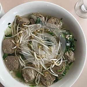 Healthy Asian Cuisine: Pho Noodle Soup with Meatballs, bean sprouts and cilantro