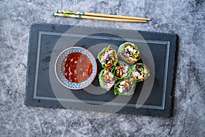 Healthy Asian Vietnamese Spring Roll / Goicuon with Rice Paper Rolls and Red Hot Chili Sauce