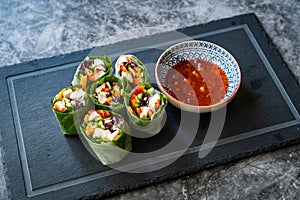 Healthy Asian Vietnamese Spring Roll / Goicuon with Rice Paper Rolls and Red Hot Chili Sauce