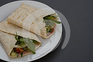 Healthy avocado and vegetables burrito, wraps, rolles. Healthy breakfast or snack. Avocado sandwich. Copy space photo