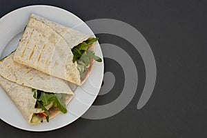 Healthy avocado and vegetables burrito, wraps, rolles. Healthy breakfast or snack. Avocado sandwich. Copy space photo