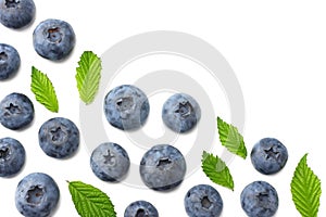 Healthy background. blueberries with leaves isolated on white background. top view