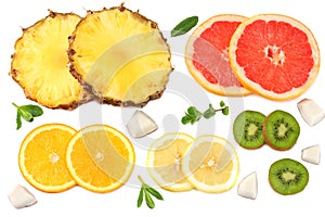 healthy background. slices of grapefruit, kiwi fruit, orange and pineapple isolated on white background top view