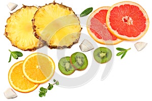 Healthy background. slices of grapefruit, kiwi fruit, orange and pineapple isolated on white background top view