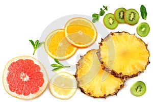 healthy background. slices of grapefruit, kiwi fruit, orange and pineapple isolated on white background top view