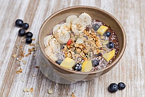Healthy banana, mango a blackberry dessert with oat and yogurt