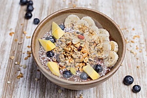 Healthy banana, mango a blackberry dessert with oat and yogurt