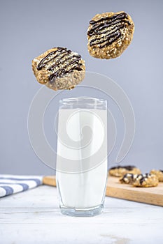 Healthy banana oatmeal cookies with chocolate, healthy dessert with milk for breakfast