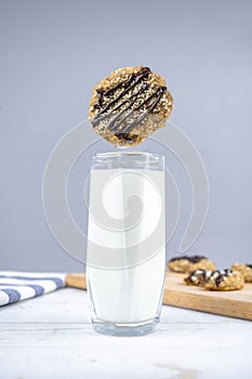 Healthy banana oatmeal cookies with chocolate, healthy dessert with milk for breakfast