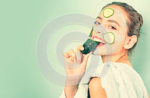 Healthy and beautiful. Girl chilling making clay facial mask with cucumber. Skin health. Woman adorable smiling girl