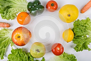 Healthy bio food arranged in circle on the table with copy space in the middle. Organic fruits and vegetables from farm garden.