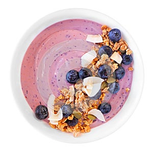 Healthy blueberry smoothie bowl isolated on a white background