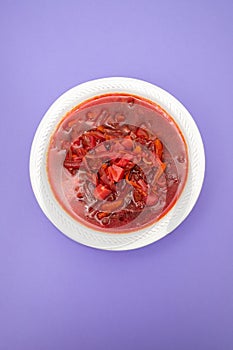 Healthy borsh beet soup in white bowl