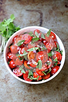 Healthy bowl of Cherry tomatoes and watercress