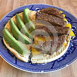 Healthy Breakfast Avocado with Meat and Pita on Plate