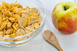 Healthy breakfast, bowl of cereal and apple