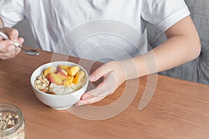 Healthy breakfast bowl in hands