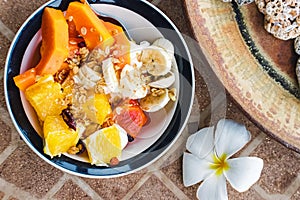 Healthy breakfast bowl with yogurt and tropic fruits