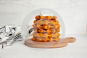 Carrot waffles with sour cream