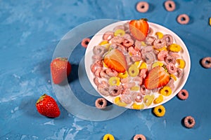 Healthy breakfast with cereal and berries. From above of bowl with delicious healthy breakfast made with colorful cereal