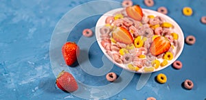 Healthy breakfast with cereal and berries. From above of bowl with delicious healthy breakfast made with colorful cereal