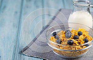 Healthy breakfast cereal with blueberries and milk