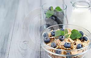 Healthy breakfast cereal with blueberries and milk