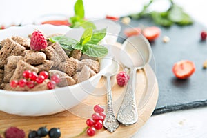 Healthy breakfast cereal with fruit on the summer table with a white tablecloth Healthy tasty breakfast chocolate square