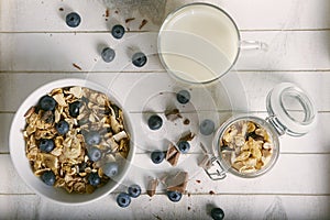 Healthy breakfast composition with milk blueberry cereals and ch photo