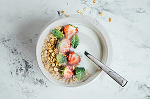 Healthy breakfast concept. Bowl with granola, yogurt and berries. Top view, flat lay