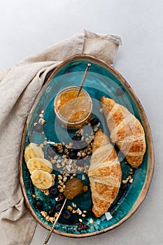 Healthy breakfast concept. Croissants and lemon jam.