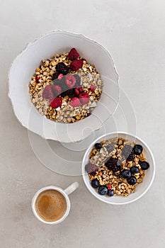 Healthy breakfast concept. Granola with coffee and berries.