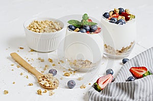 Healthy Breakfast Concept. Muesli with Greek Yogurt, Strawberries and Blueberries