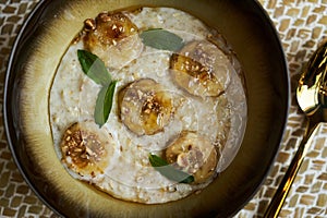 Healthy breakfast concept with oatmeal bowl and milk glass