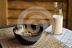 Healthy breakfast concept with oatmeal bowl and milk glass