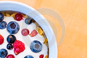 Healthy breakfast  - Cornflakes with fresh bilberries