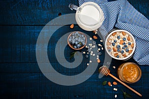 A healthy breakfast on a dark blue wooden background