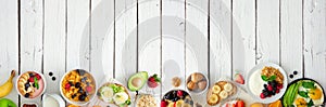 Healthy breakfast food banner with bottom border of fruits, yogurt, smoothie bowl, nutritious toasts, cereal and egg skillet, top