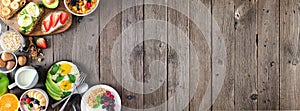 Healthy breakfast food banner with table scene side border of fruit, yogurt, smoothie bowl, nutritious toasts, cereal and egg skil