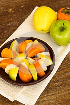 Healthy breakfast with fruit salad, granola and coffee.