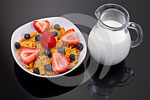 Healthy breakfast with fruity corn flakes and milk