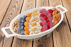 Healthy breakfast - granola and fruits photo