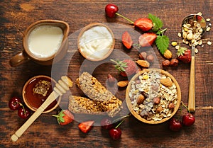 Healthy breakfast with homemade granola, berries and muesli