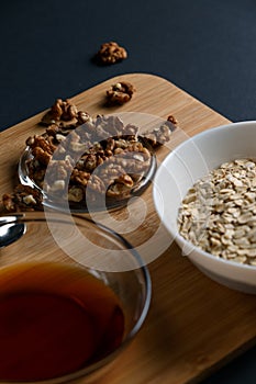 Healthy Breakfast ingredients: honey, walnuts, oatmeal