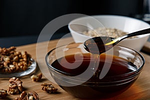 Healthy Breakfast ingredients: honey, walnuts, oatmeal