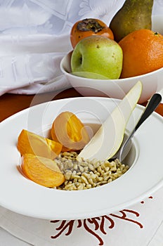 Healthy Breakfast: Kamut, Flax-Seeds, Pear And Persimmon